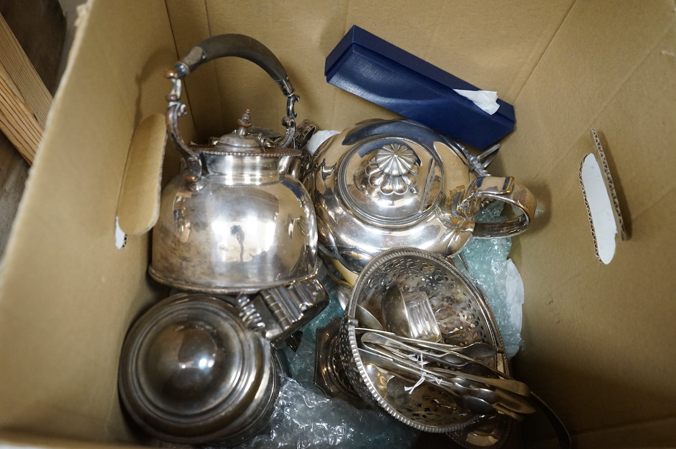 A group of assorted plated wares including an Old Sheffield plated tankard, tea kettle, teapot, flatware etc.